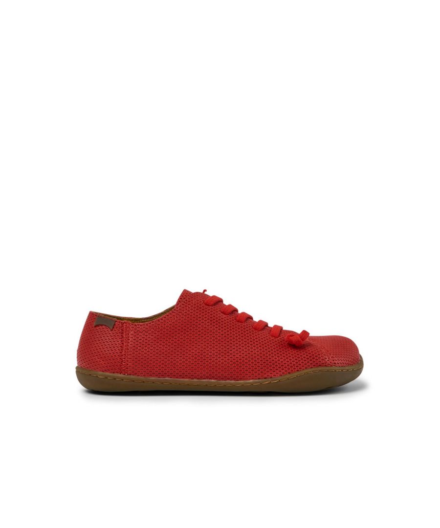 Red leather women's shoes with 100% TPU outsoles (20% recycled) and elastic laces. \n\nA Camper Icon that evolves with every season. Peu is functional simplicity inspired by walking barefoot. It is 360-degree stitched and built with a Strobel construction technique, guaranteeing unmatched flex and durability under any conditions.