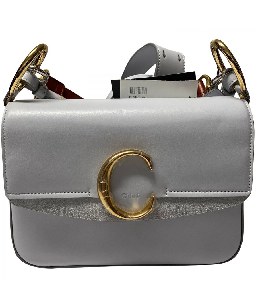 Embracing a bold jewellery aesthetic, the Maison’s namesake double carry bag has a sleek design finished with a signature gold-toned “C” on the layered flap. The interplay of shiny and suede calfskin, masculine-meets-feminine allure and chunky leather straps elevate the urban mood.\n\nChloe C Double Carry Bag in Grey Leather\nColor: grey\nMaterial: Leather\nCondition: new with tag\nSign of wear: No\nSKU: 147278 / NAPBKGBBA080394W  \nDimensions:  Length: 150 mm, Width: 130 mm, Height: 250 mm
