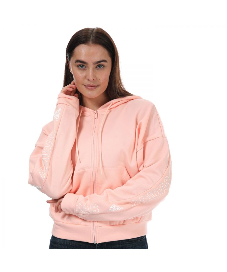 Womens adidas BOS Back- Print Zip Hoody in coral.- Lined drawcord hood.- Ribbed cuffs and hem.- Long sleeves.- Zip fastening.- Kangaroo pockets.- Fleece.- Loose fit.- Main Material: 70% Cotton  30% Polyester (Recycled). Machine wash at 30 degrees.- Ref: GH7378