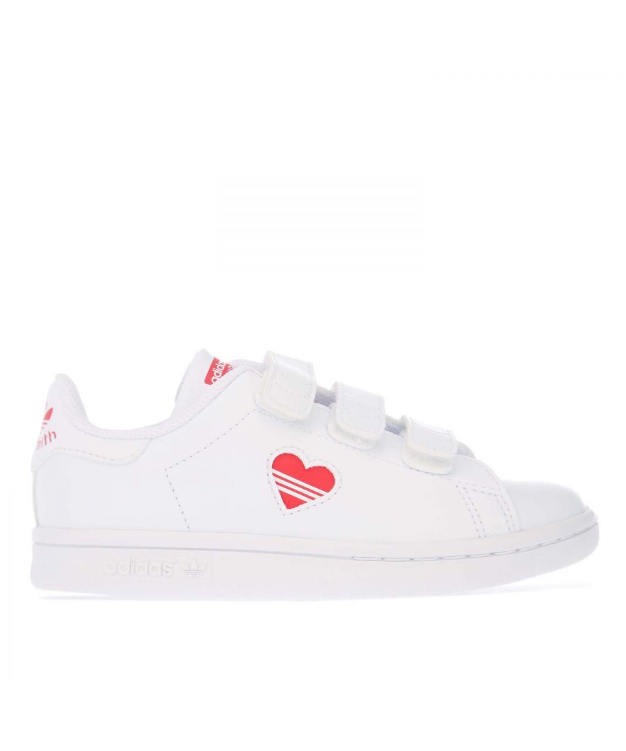 Childrens adidas Originals Stan Smith Trainers in white red.- Vegan upper made with a minimum of 50% recycled materials.- Hook-and-loop closure.- OrthoLite® sockliner.- Bright red heart on the side.- Rubber cupsole.- Synthetic upper  Textile lining  Synthetic sole.- Ref.: FZ2834C
