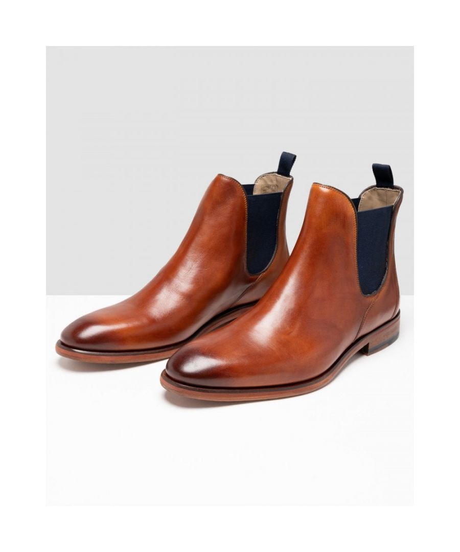 Crafted in rich tan calf leather, Allegro is our formal Chelsea boot. The classic clean design is lifted with the contrasting pops of colour in the elastic gusset and heel pull tab.\nBlake stitched constructionAntiqued leather upperLeather liningLeather soleElasticated gusset\nMade in India\nALLGLE