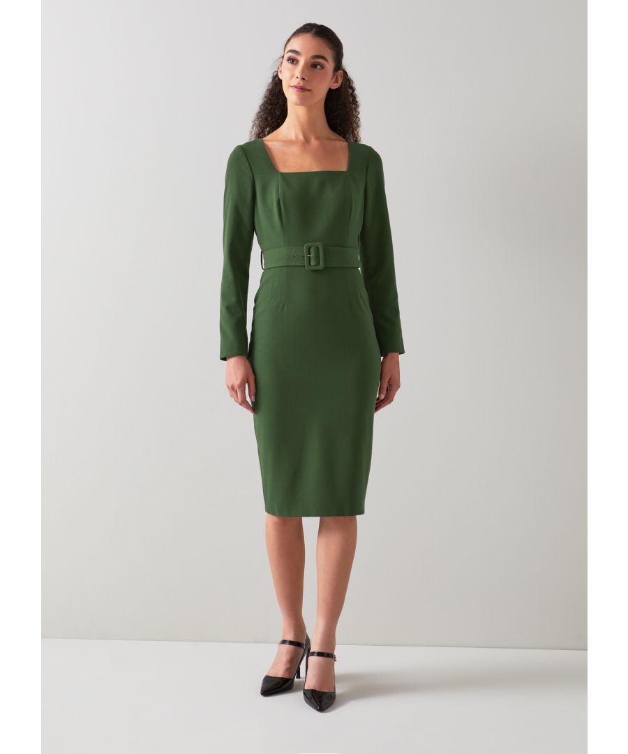 The Carrington shift dress is crafted from a recycled polyester blend in rich forest green. It's a square neck, fitted style with bracelet-length sleeves, a waist-cinching belt, and it falls to just below the knee.