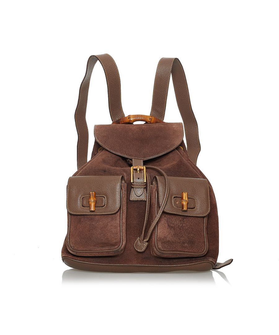 VINTAGE. RRP AS NEW. This backpack features a suede and leather body, exterior front flap pockets with a bamboo twist lock closure, flat leather back straps, a bamboo top handle, a top flap with a magnetic closure, a drawstring closure, and an interior zip pocket.Exterior back is discolored, out of shape, scratched and stained. Exterior bottom is discolored, out of shape and scratched. Exterior corners is out of shape and scratched. Exterior front is discolored, out of shape, scratched and stained. Exterior handle is out of shape and scratched. Exterior pocket is discolored, out of shape, scratched and stained. Exterior side is discolored and stained. Buckle is scratched. Screw is scratched. Zipper is scratched. Interior lining is discolored and stained. Interior pocket is discolored and stained.\n\nDimensions:\nLength 28cm\nWidth 28cm\nDepth 8.5cm\nShoulder Drop 80cm\n\nOriginal Accessories: This item has no other original accessories.\n\nSerial Number: 003 2058\nColor: Brown\nMaterial: Leather x Suede x Natural Material\nCountry of Origin: ITALY\nBoutique Reference: SSU173738K1342\n\n\nProduct Rating: FairCondition\n\nCertificate of Authenticity is available upon request with no extra fee required. Please contact our customer service team.