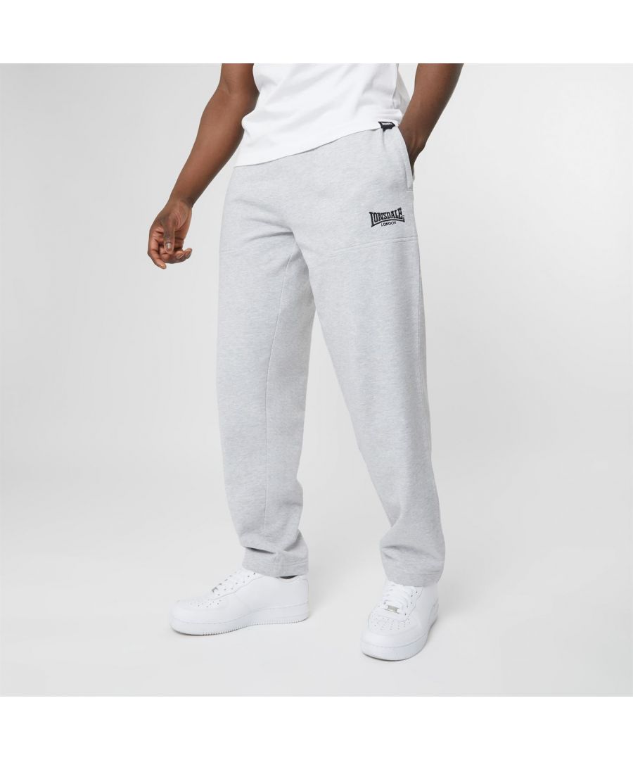 A modern day classic, made for comfort, style and longevity. Crafted from heavy weight cotton rich loopback jersey these best selling joggers are designed for maximum comfort and durability. Cut for a regular fit you'll be stepping out of your house in style whether you're off to training or to the shops. Complete with classic, understated Lonsdale logo embroidered on the leg perfect for a low-key, effortless look. Get the look and wear yours with the Heavyweight Jersey Lounge Hoodie.