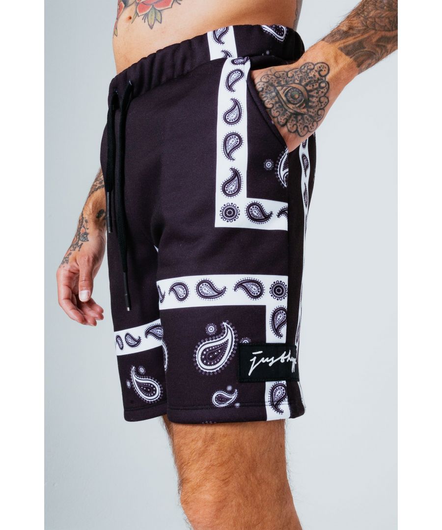The HYPE. Black Paisley Shorts are your go-to summer staple. Designed in a 80% cotton and 20% polyester fabric base for the ultimate comfort. With drawstring pullers and an elasticated waistband. Finished with a bandana paisley inspired all-over print in a monochrome colour palette. Wear with the matching hoodie to complete the look. Machine washable.