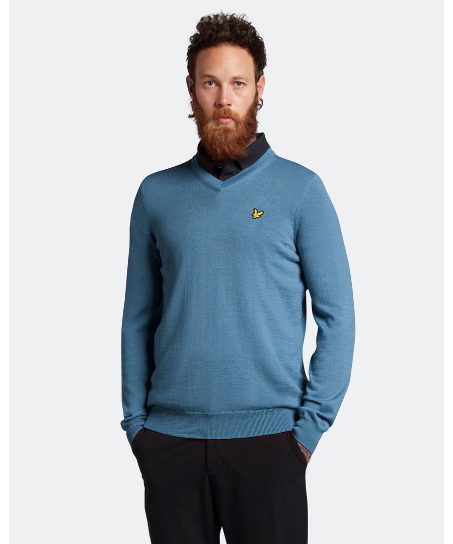 Perfect for cooler days on the course, the Lyle & Scott V Neck Pullover is a timeless, versatile piece that will become a staple of your performance collection. Made from a soft but durable Merino-Acrylic blend that keeps you warm whilst enhancing mobility, you can look good and never sacrifice your swing. Finished with ribbed cuffs, collar, and hem for the perfect fit, as well as our signature Golden Eagle. \n \nFit: Regular\nIt is crafted to fit the body neither too tightly or too loosely, leaving you with a classic, timelessly stylish look. We recommend you order your usual size, but if you're caught between two, go a size up.