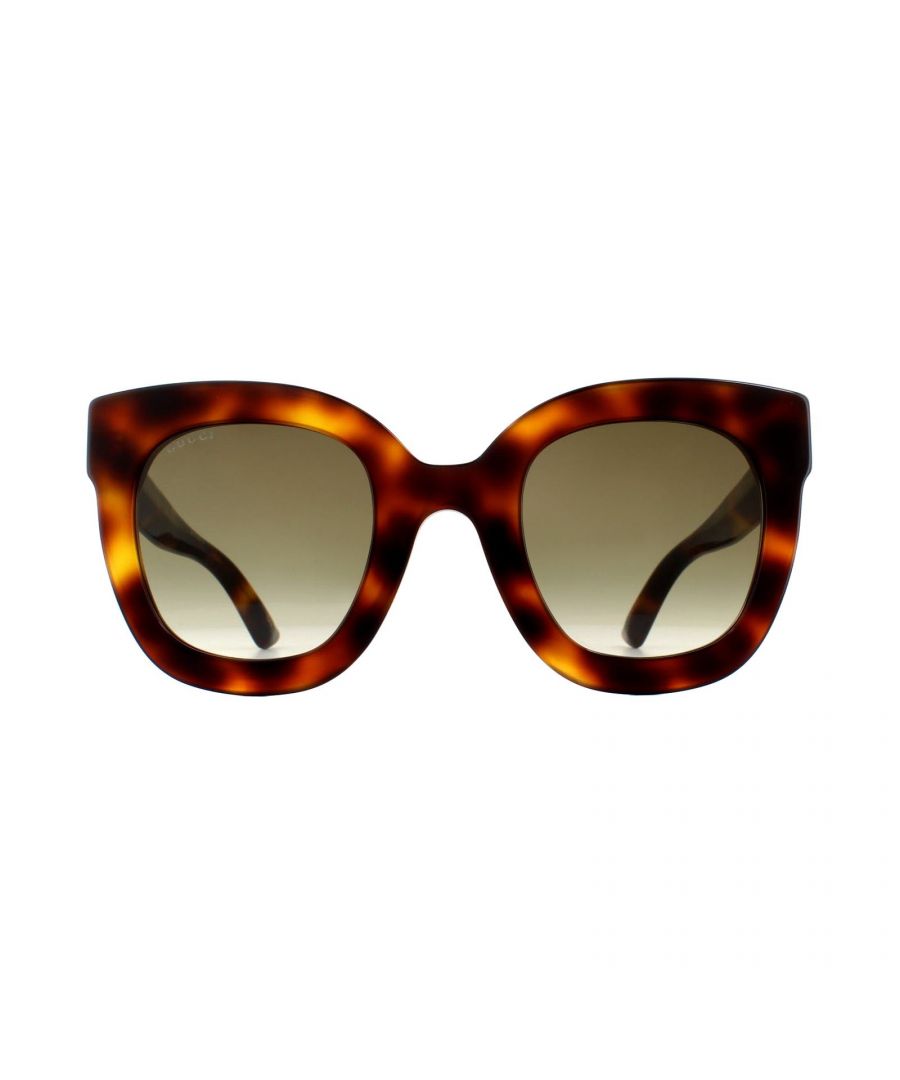 Gucci Sunglasses GG0208S 003 Havana Brown Gradient are an ultra feminine oversized square style made from lightweight acetate. The thick temples feature the interlocking Gucci GG logo, surrounded by stars and the bumblebee motif at the temple tips.