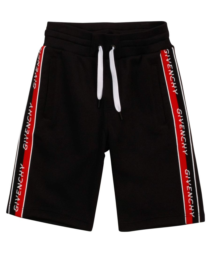 Boys black cotton piqué Bermuda shorts by  Givenchy. Mid-weight and stretchy, they have 'Givenchy Split' logo taping down the sides in red, white and black. They have an adjustable drawstring waist and side pockets.\n\n\n53% cotton, 47% polyester (mid-weight piqué)\nMachine wash (30*C)\nAdjustable drawstring waist\nSmall fitting brand