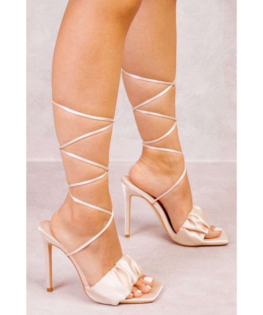 Women's stiletto heels featuring long tie straps to wrap around the leg or ankle and square toe with ruched front strap.\n\nHeel Height: 4.7' (12 cm) Approx