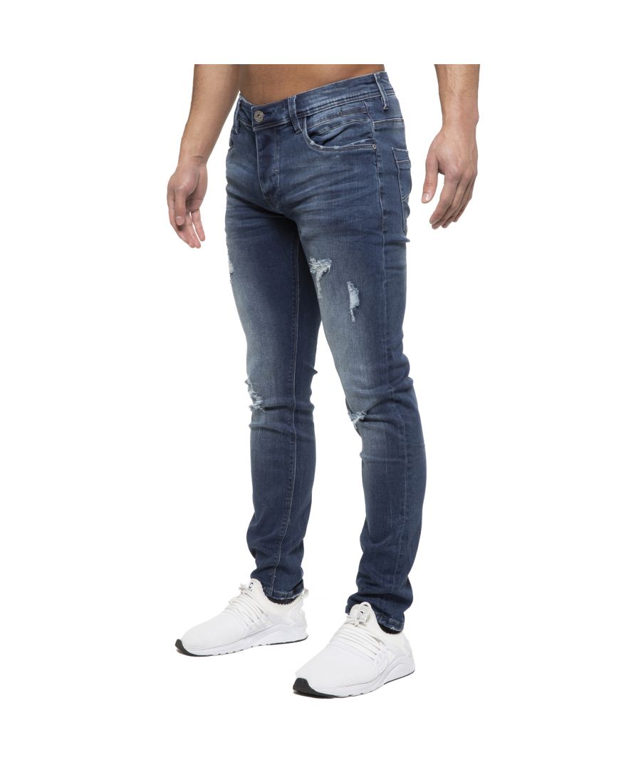 Fresh of the press these mid stonewash denim hyper stretch jeans are the perfect addition to your summer wardrobe, featuring subtle stitching design to back pockets and leather waist branded label to back. 5 Classic style pockets including a coin pocket and button fly, contrast stitching detail throughout. Distressed and ripped detail to front to complete the look.