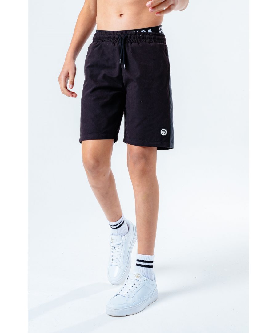 The Hype. Reflective Panel boys swim shorts features a reflectobe fade effect. In a 100% polyester fabric base for supreme comfort in our standard unisex kids shorts shape, highlighting an elasticated waistband. Finished with on trend leg panelling in a reflective print and the iconic HYPE. rubberised crest logo. The ultimate shorts that you'll want to wear in the pool. Machine wash at 30 degrees.
