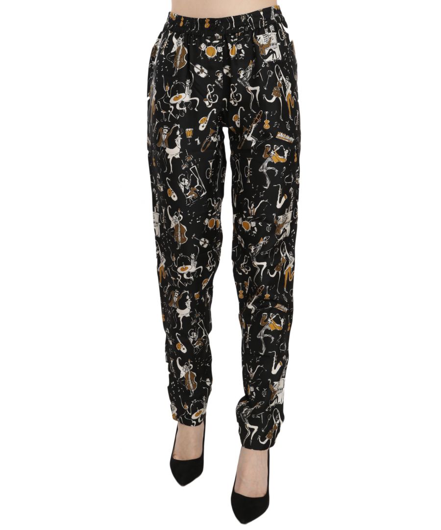Dolce & Gabbana Schitterende gloednieuw met tags, 100% Authentieke Dolce & Gabbana Broek. Model: Hoge taille taps toelopende broek Kleur: Zwart jazz club print Logo details Made in Italy Materiaal: 100% Zijde