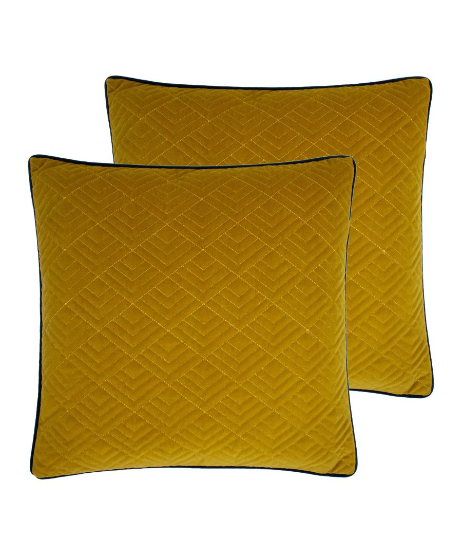 Add a pop of colour to your interior with this luxurious and comforting cushion. The geometric, art deco inspired design is stitched with a gold trim and is complete with contrast-coloured piping. The embroidered design adds a textured appearance which allows the richer jewel toned hues to instantly shine and make a statement.