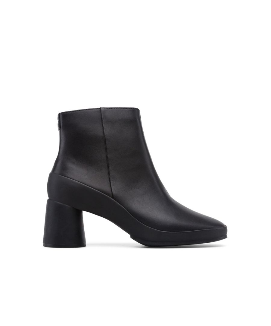 Women's black ankle boot. Full grain leather upper with rubber outsole and removable EVA insole.\n\nOur Upright combines deconstructed uppers in soft leathers and vibrant seasonal colors that truly embody the Camper spirit.