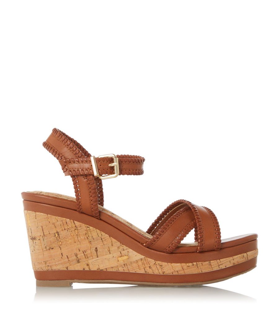 Designed to work with your wardrobe. The cork-effect and whipstitch detail add an artisan feel to these wedges. The criss-cross straps provide support and the rubber sole grips well.