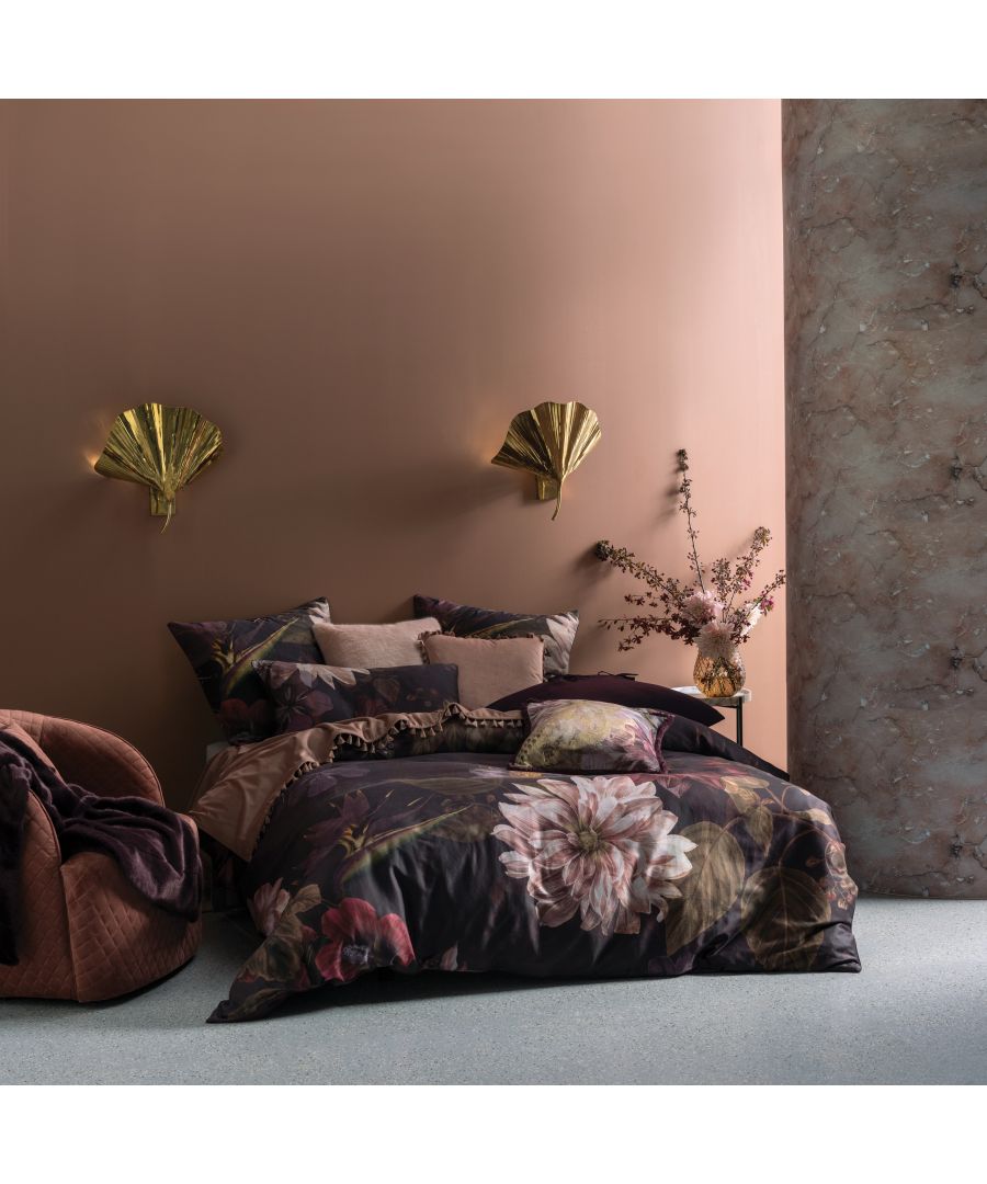 Dark and serene, a stunning floral, embodying a style that has become a signature look from our studio. This Dutch Masters inspired print features an array of foliage and tropical flora in the most delicious and richly saturated shades of plum and wine. Printed on a cotton sateen, this luxurious story is brought to life with tactile printed velvet and gold accented accessories.