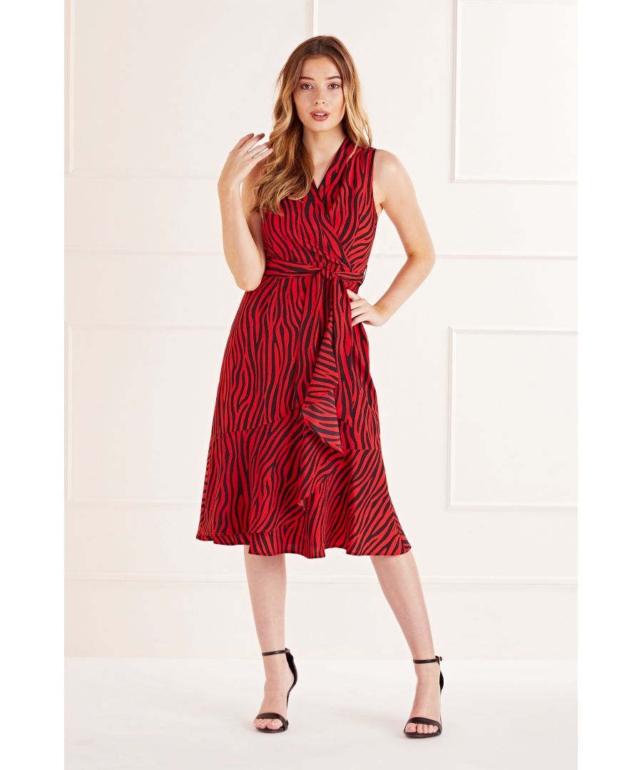 This sophisticated Zebra Printed Wrap Effect is the perfect fit for all dress codes. In a statement midi shape, it features a sleeveless wrap bodice and elegant ruffles falling from the self-tie waist. A zip fastening runs down the back, whilst the wild zebra print will make sure all eyes are on you. Finished with a stylish peplum hem, wear with knee-high boots.  Shell:100% Polyester, Lining:100% Polyester Machine Wash At 30 Length is 112cm Model Wears Size 10