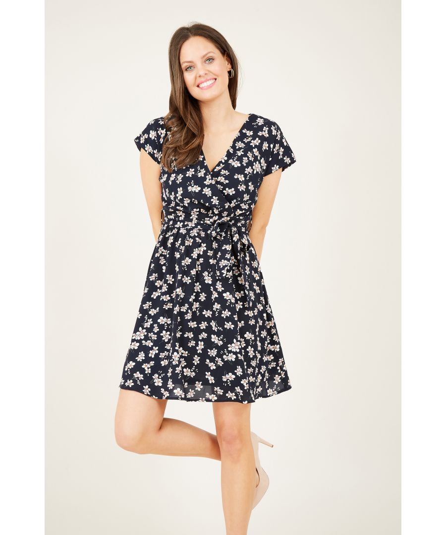 Refresh your florals with this Ditsy Daisy Wrap Front Skater Dress. In a sophisticated shade of black, this skater dress has been upgraded with light daisies popping against the base. With a zip fastening running down the back, it comes with a self-tie waist that creates shape and enhances your curves. It’s the perfect pairing for white trainers and a denim jacket.  100% Polyester, Lining:100% Polyester Machine Wash At 30 Length is 90cm/35inches