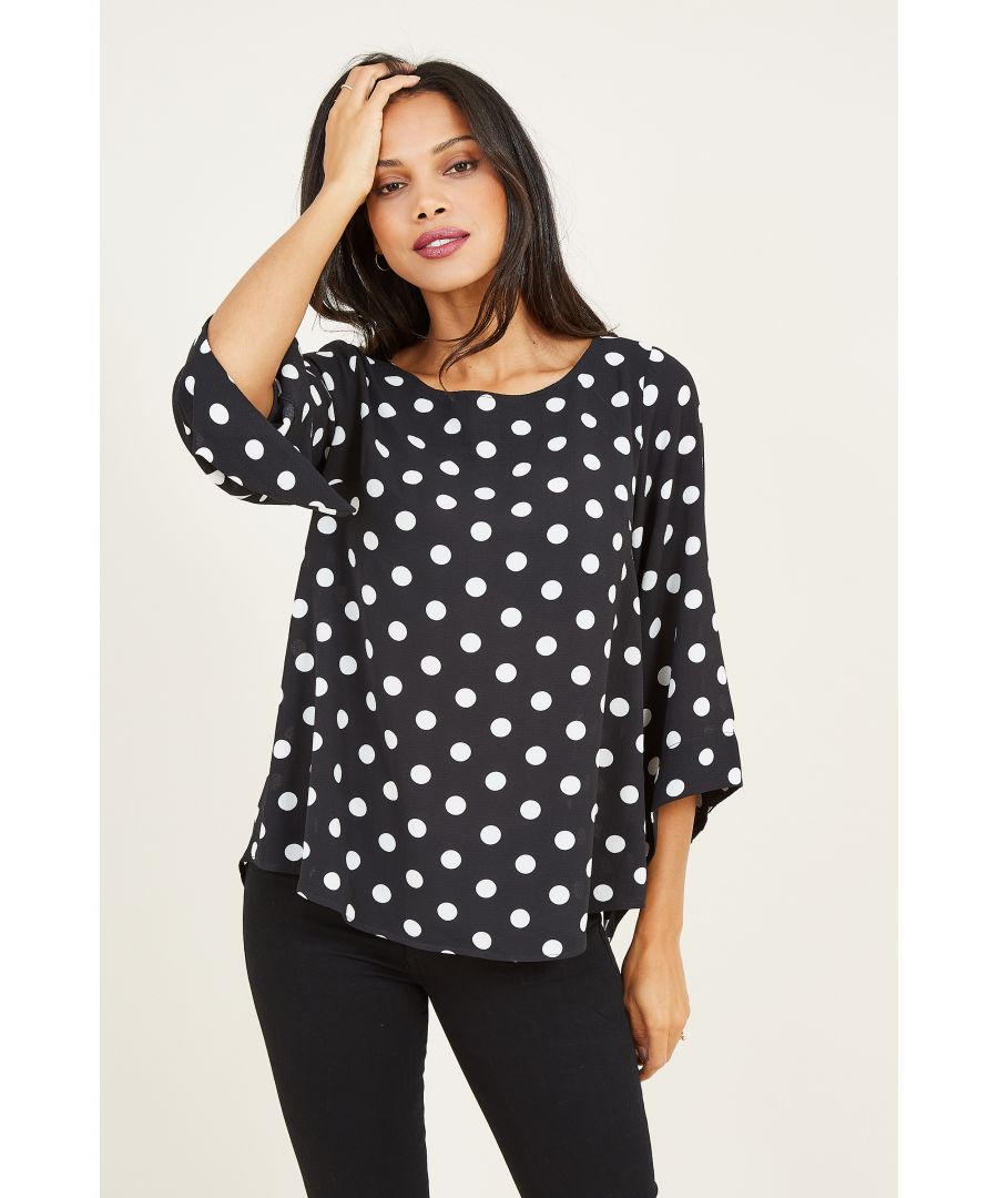 This stylish Polka Dot Blouse from Mela works well as a wardrobe staple. Its soft shape gathers into the neck, while the floaty batwing sleeves finish below the elbow for an elegant touch. Try it tucked into sleek cigarette trousers and team with boots or heels.