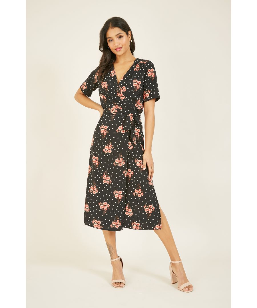 Never settle for one print when you can have two - meet our Mela Floral Wrap Spot Midi Dress. Designed with short sleeves and a wrap bodice that ties at the side, it's enhanced by a flourishing floral and polka dot print. The lightweight and soft-touch fabric makes it a comfortable and