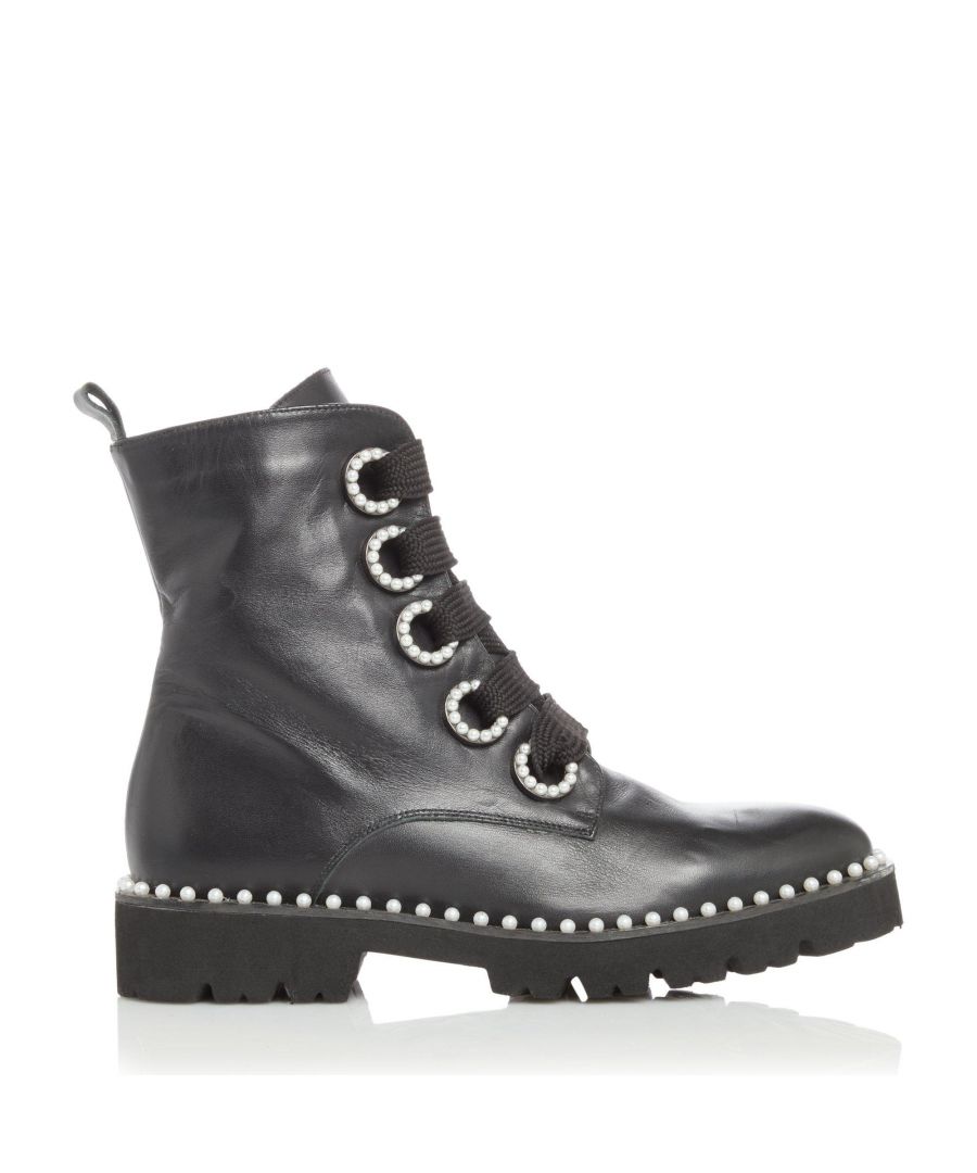 A feminine twist on the classic biker boot look. With pearl edging, these boots add a hint of delicate charm. Complete with thick laces, a pull tab and a cleated sole.