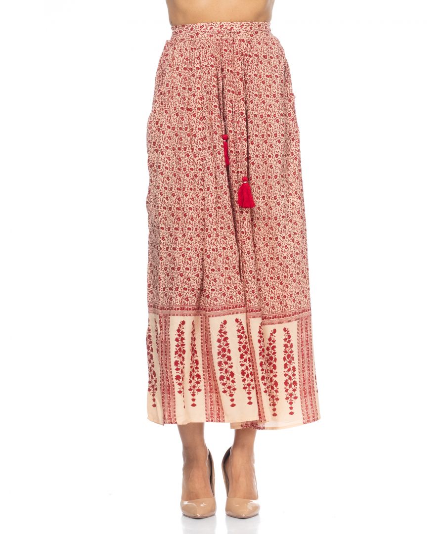 Long skirt with flower print, pompoms and elastic waist at the back.