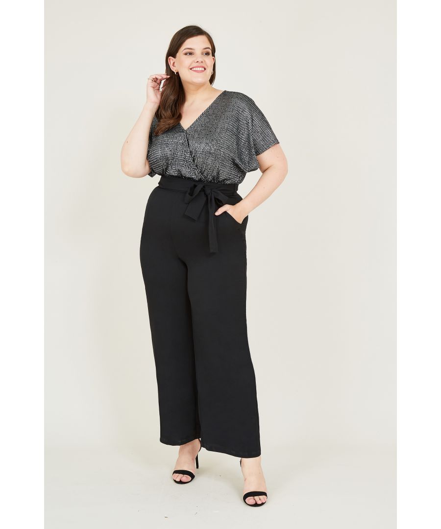 Channel retro charm when you opt for this Plus Size Metallic Wrap Jumpsuit. Designed with light metallic fabric decorating the wrap bodice, it's styled with dropped shoulders and flared sleeves. Below, flared trousers create a flattering silhouette, whilst the zip fastening on the back makes it easy to slip off after a late evening.