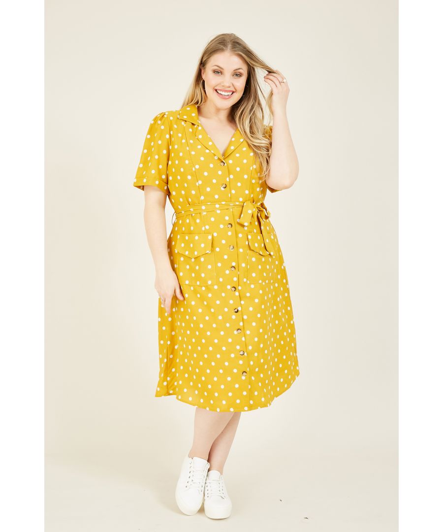 Add a retro twist to your wardrobe with this Yumi Plus Size Spotted Shirt Dress. With a nod to 60s style, it's designed with a relaxed shape that secures with a waist tie. Buttons run down the front for a casual touch, while the pockets and polka-dot print are the perfect finishing touches. Pair with trainers for weekends.