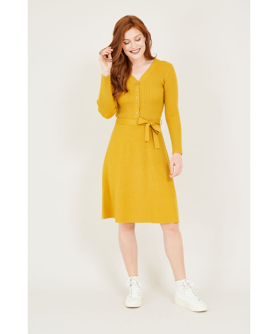 Our bestselling shape is back (and just in the knit of time). Featuring a classic fit and flare shape, this Knitted Skater Dress is detailed with a button front, self-tie waist and luxuriously long sleeves. The blend of soft fabrics bring comfort to your look, with gentle ribbed enhancements keeping your look classic and casual.