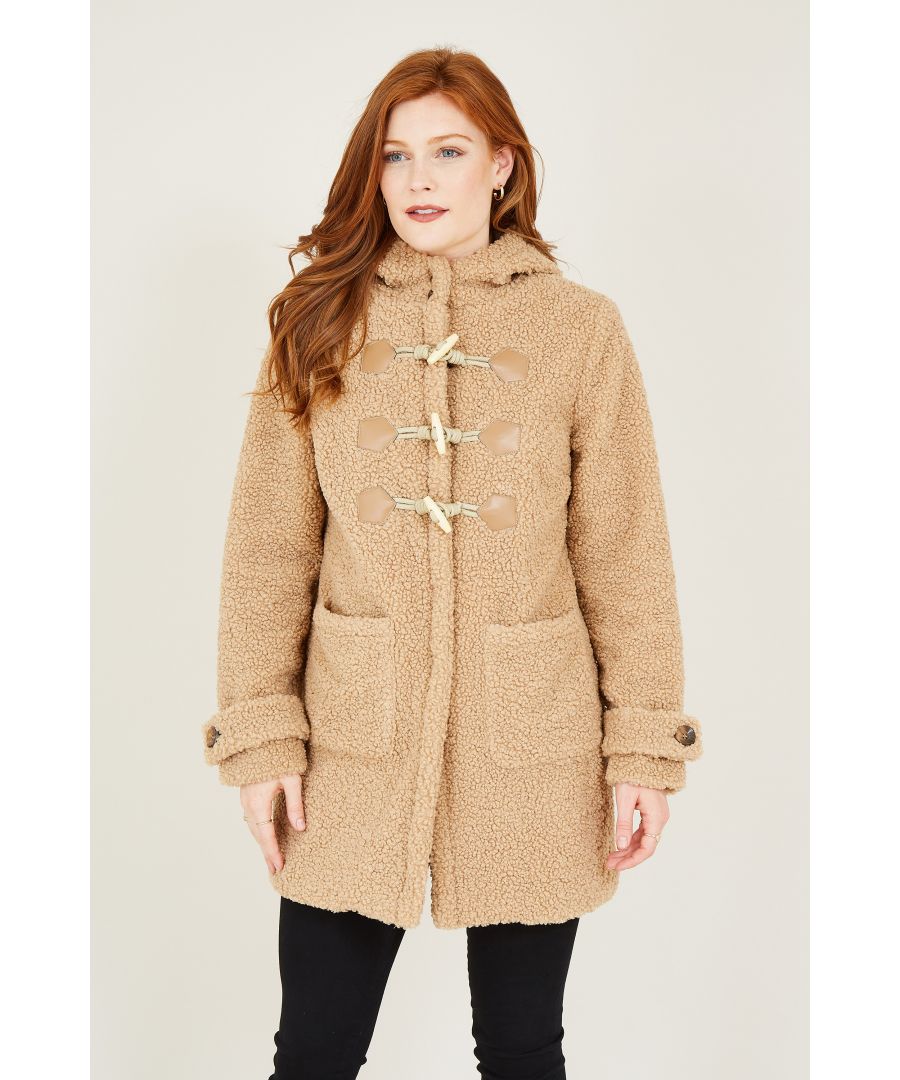 Keep cosy on cooler days in our Teddy Bear Duffle Coat. Combining two iconic shapes, it's designed with duffle notches on the front and fluffy fabric running from the hood to the hemline. Two pockets sit on the side, perfect for warming cold hands, whilst the button details on the cuffs add a chic touch. Complete with a fully-lined interior, layer over your off-duty wardrobe.
