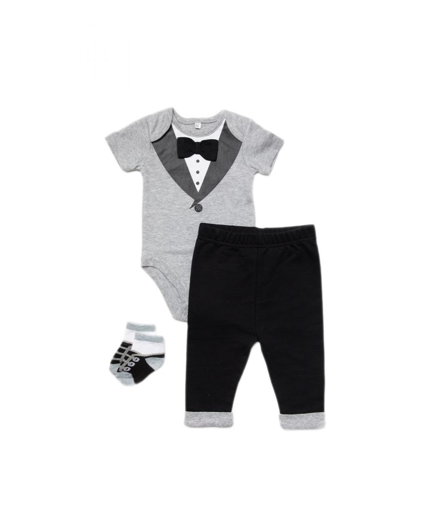 This Little Gent four-piece set features a charming tuxedo theme. The set includes a bodysuit with a tuxedo and bowtie print, a pair of trousers, and a pair of socks, imitating little smart shoes. Each item in the set is cotton with popper fastenings, keeping your little one comfortable. This set is the perfect gift or new addition to your little one’s wardrobe.