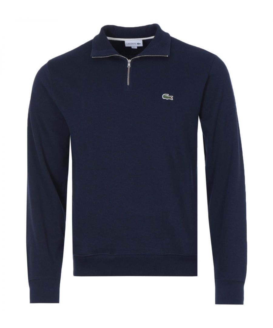 Mens Lacoste Zippered Stand- Up Collar Cotton Sweatshirt in navy.- Zip ribbed stand up polo collar.- Tone-on-tone ribbed finishes at bottom of garment and sleeve ends.- Ribbed cotton interlock fabric.- Embroidered green crocodile on chest.- Classic fit.- 100% Cotton.- Ref: SH192700166