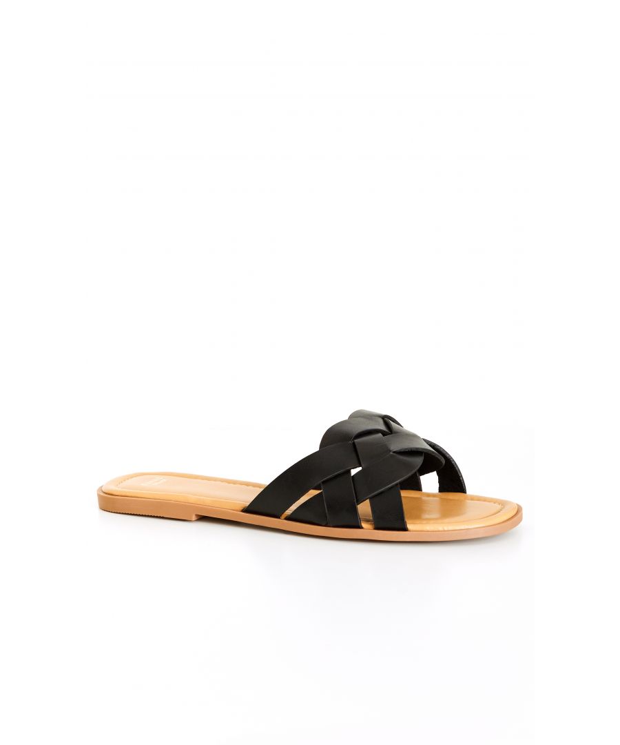 Bring on easy days with the extra wide fit and effortless slip-on comfort of the black Avril Cross Slide. The faux leather finish adds sophistication to a classic flat slide, perfect for any occasion. Key Features Include - Round open toe - Braided crossover strap - Faux leather fabrication - Extra wide fit - Slip on style - Flat sole