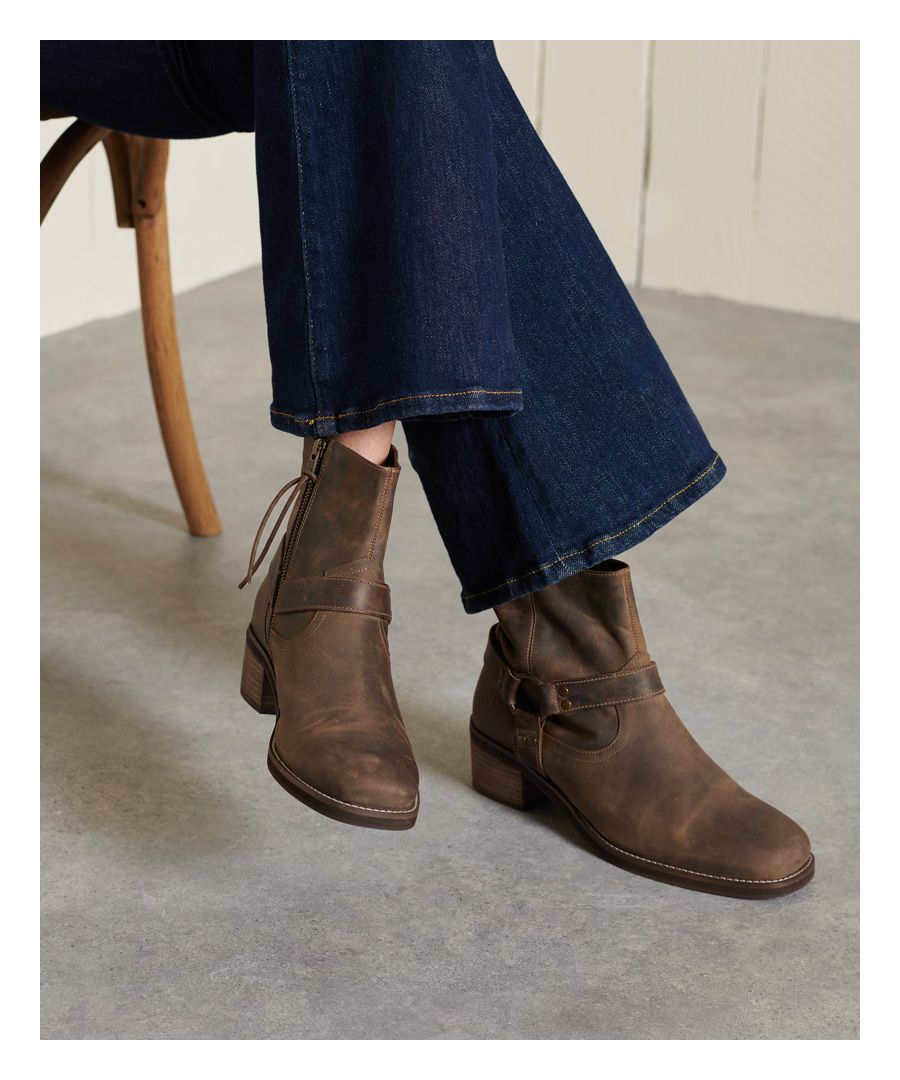 If you're looking to toughen up a classic look, you don't have to saddle up or sacrifice comfort. Our Biker boots in weathered finish leather will fit the bill.Vintage finish leather uppersBlock heelAnkle strapSide zip with cord pullerSubtly embossed heel counter5cm heel