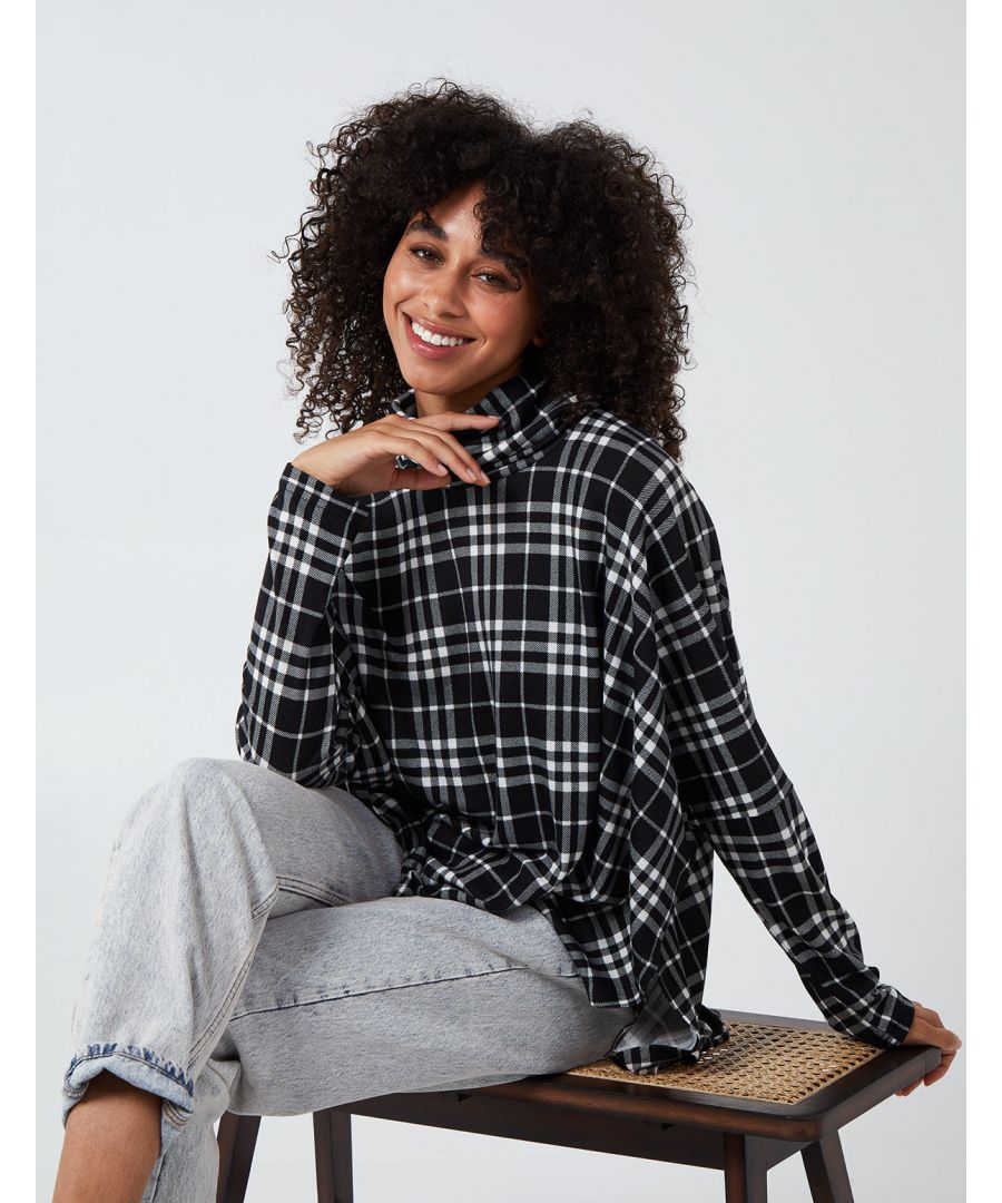 Go oversized this winter with this check print top. The shape of this garment compliments any figure shape as it is long and flowing. Works great with jeans and sneakers or dressed up with black heels!\n95% polyester, 5% Elastane. Machine washable. Roll neck. Long sleeve. Approx. length 67 cm unfastened. This item is a ONE size that fits UK 8-14.