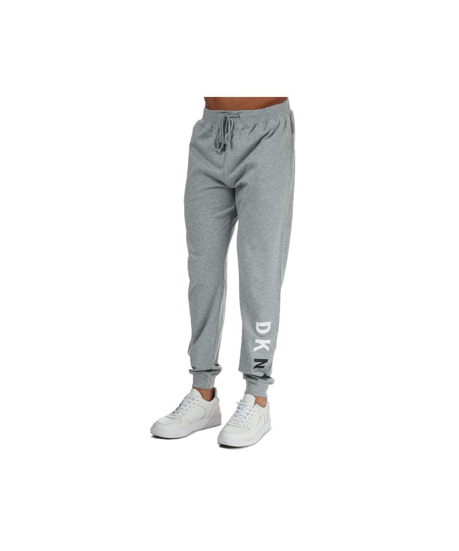 Mens DKNY Avaitor Lounge Jog Pant in grey marl.- Elasticated waistband and drawstring adjustment.- Two hand pockets.- Ribbed cuffs.- DKNY branding.- Main material: 100% Cotton. Machine washable. - Ref: N56767