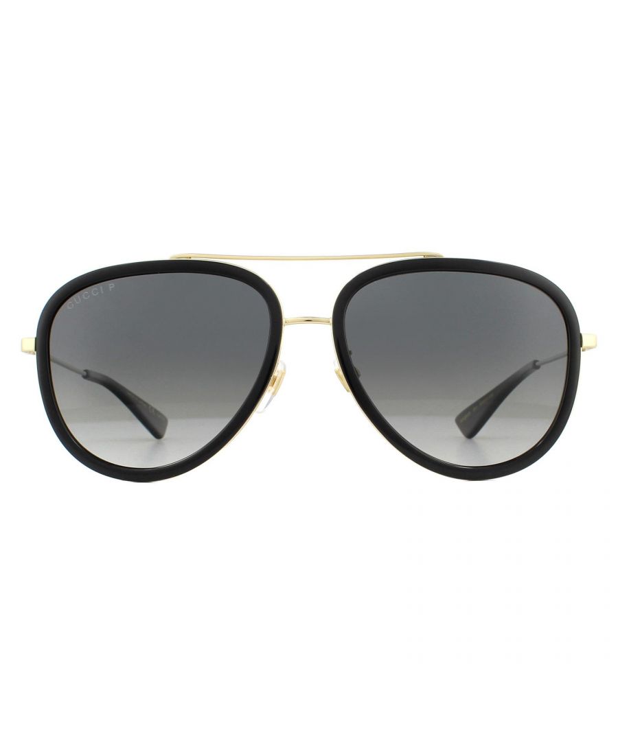 Gucci Sunglasses GG0062S 011 Black And Gold Grey Gradient Polarized feature an acetate front to the feminine metal aviator style design for a striking modern update to the classic pilot style. Subtle touches such as GG logo at the temples and double bridge complete the funky modern look.