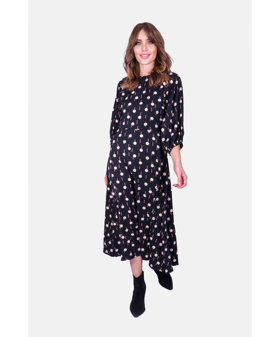 Geometric prints and feminine silhouettes define the Drape Midi Dress. Crafted from a stand out geometric pattern, the Drape dress is tailored in to a simple silhouette with 3/4 sleeves and a flared midi-length skirt. 70% Polyester 30% Viscose