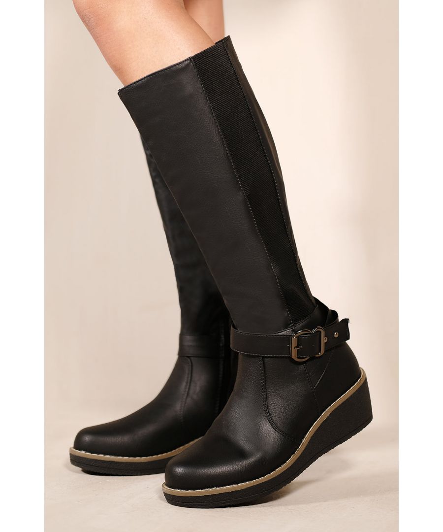 This boot is a must-have for those who want to make a statement. These boots feature wedge heel and elastic panel which makes its design beautiful and easy to pair with any outfit. These boots are ideal if you want to look stylish this winter season and make you feel confident and sexy as you walk down the street.