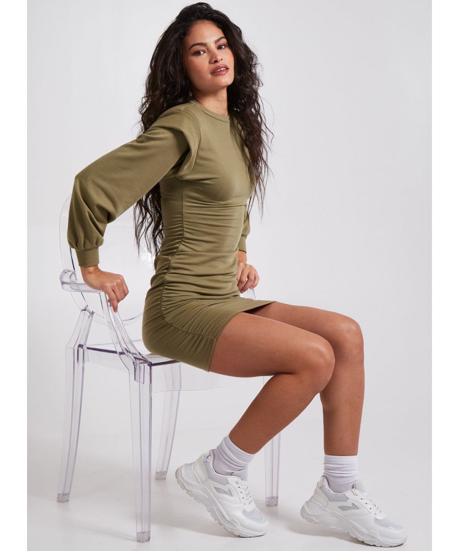 Add some comfy vibes to your look with this dress. Featuring a khaki material with a shoulder pads and a gathered hem detail. Style with kicker boots to complete the look. Composition: 95% Polyester, 5% Elastane. Wash care: Machine Washable.