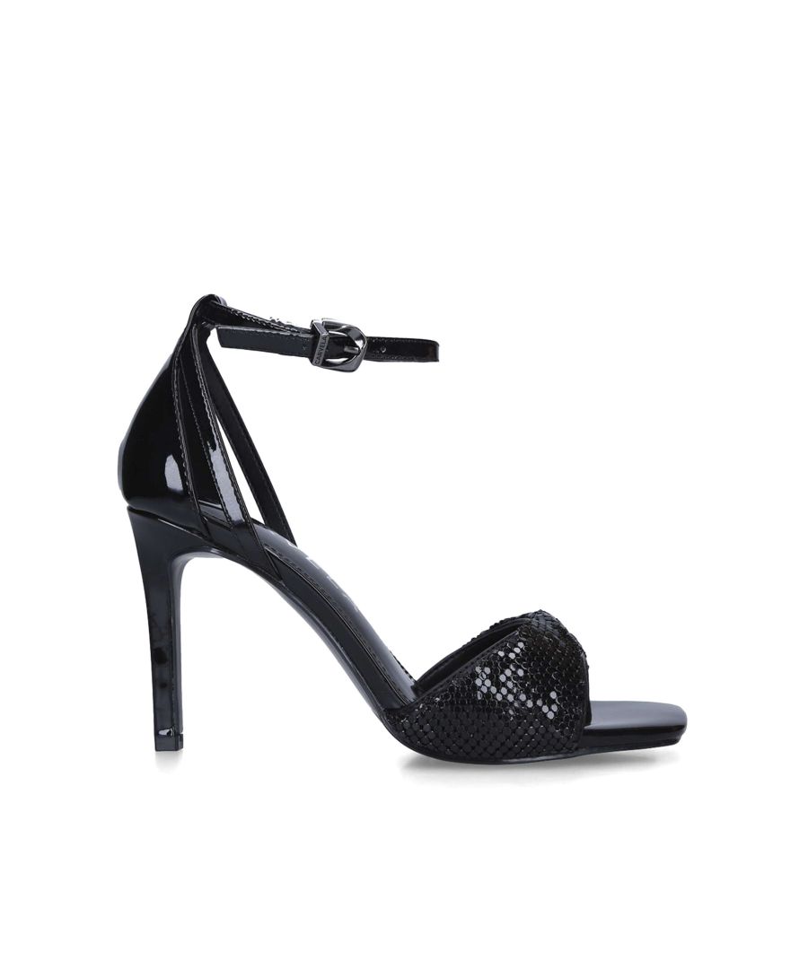 The Protect heel arrives in patent black with chainmail toe strap. The ankle is fastened with gunmetal buckle.