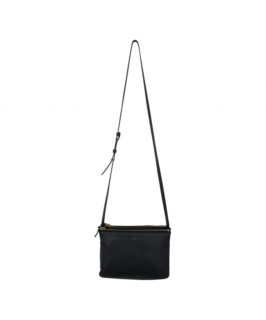 VINTAGE, RRP AS NEW\nThe iconic Trio bag from Céline is always a sound investment!Made from 100% smooth, black lambskin. With an adjustable leather strap long enough to be worn over the shoulder or crossbody.The bag is formed of three pouches assembled into one bag, via snap buttons, allowing for belongings to be neatly stored. The pouches can be separate to allow for a smaller bag or a clutch.Gold-tone metal hardware, including the zips that close each pouch. Each pouch opens to a compartment lined in jersey fabric.Dimensions: 9 X 6 X 2 inches (22 X 15 X 4 cm).\nStrap drop: 20 inches (51 cm)Very good condition (8.9/10). Interior excellent other than one pull in the lining of the third compartment. Gold embossed brand name very worn. Tarnish on the hardware. On scuff on one corner, otherwise the corners and leather are excellent. Box NoDust bag NoSeason All seasons\nCeline Céline Trio bag in black leather\nColor: black\nMaterial: Leather\nCondition: excellent\nSize: One Size\nSign of wear: No\nSKU: 152513 / UT221302 / UT221302