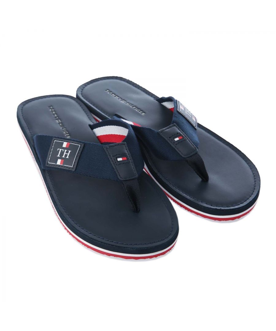 Mens Tommy Hilfiger Elevated Leather Beach Sandal in navy.- Synthetic upper.- Slip on closure.- Secure strap fastening.- Branded toe thong.- Branding to the sole and insole.- Tommy Hilfiger branding to footbed.- EVA sole.- Synthetic Upper  Textile Lining  Synthetic Sole.- Ref.: FM0FM02692DW5