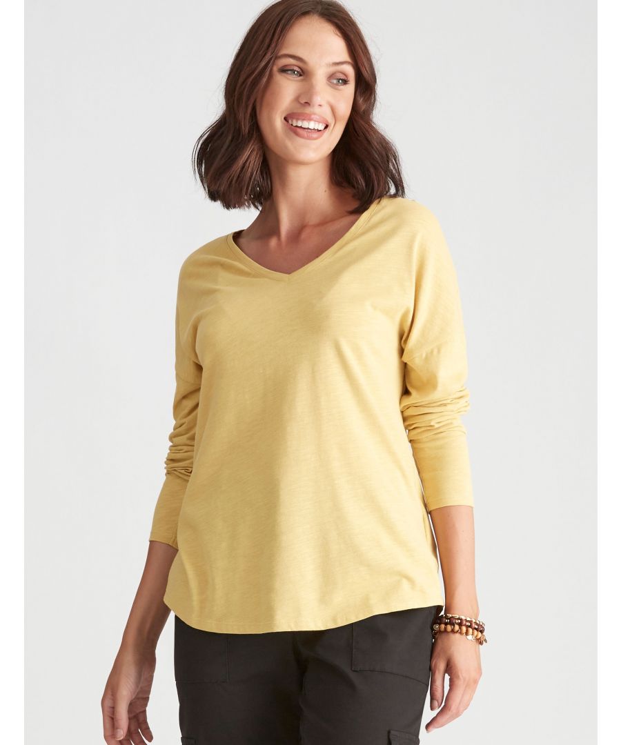 A sleek and streamlined silhouette, this 3 quarter-length sleeve top combines a cuffed hem with a fitted bodice for an effortlessly chic look. This khaki colored vneck tee boasts rounded hems that are comfortable to wear on her every day! Designed with three quarter length sleeves and an easy fitting fit that offers an effortless style without any hassles, these tops will be your new go to for multiple outfits! -- Switch up from the norm with this simple, beige-hued V-neck tee. Made with a curve hem for added feminine flair, paired with a 3/4 sleeve length, this shirt looks best layered over other pieces. A rounded hem and three quarter sleeves make this khaki tee a versatile piece to wear with almost anything. With a v neckline, it's an elevated basic that will always be on trend! -- What's not too love about this peach puff print tee? With its v-neckline, three-quarter sleeves, fitted silhouette, this T-shirt is sure not only be adored by you but those around you. A 3/4th length sleeve is the perfect addition to this khaki colored shirt. With its vneck, it's also a great piece to wear with leggings or jeans! -- Channel the style of the 1950s in this feminine peach puff v-neck. A classic fit with three quarter sleeves, this garment is perfect for both day or night. This khaki colored v neck tee has a three quarter length sleeve and fit that makes it the perfect addition to your wardrobe. The contrasting color hem adds an extra layer of interest. -- You'll be the envy of all your friends when you wear this vneck tee. The fitted silhouette and curved hem will keep you feeling fresh, while a classic vneckline offers a touch of timeless style. For those of us who like things on point, we've got just what the doctor ordered in this three fourth sleeve length v-neckline t-shirt with its basic print. -- There's no better way than pairing this burly wood t shirt with our leggings! Soft, simple, yet stylish, these essentials have everything going on.Material:  100% Cotton