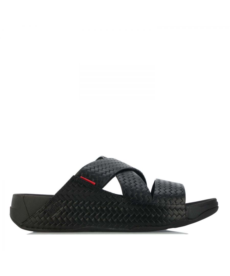 Mens Fit Flop Chi Slide In Woven Leather Sandals in black.- Leather upper.- Slip-on construction.- Supercushioned  pressure-diffusing standard Microwobbleboard midsole technology.- Biomechanically engineered.- Seamless built-in arch contour.- Slip-resistant rubber outsole. - Ref:K88001