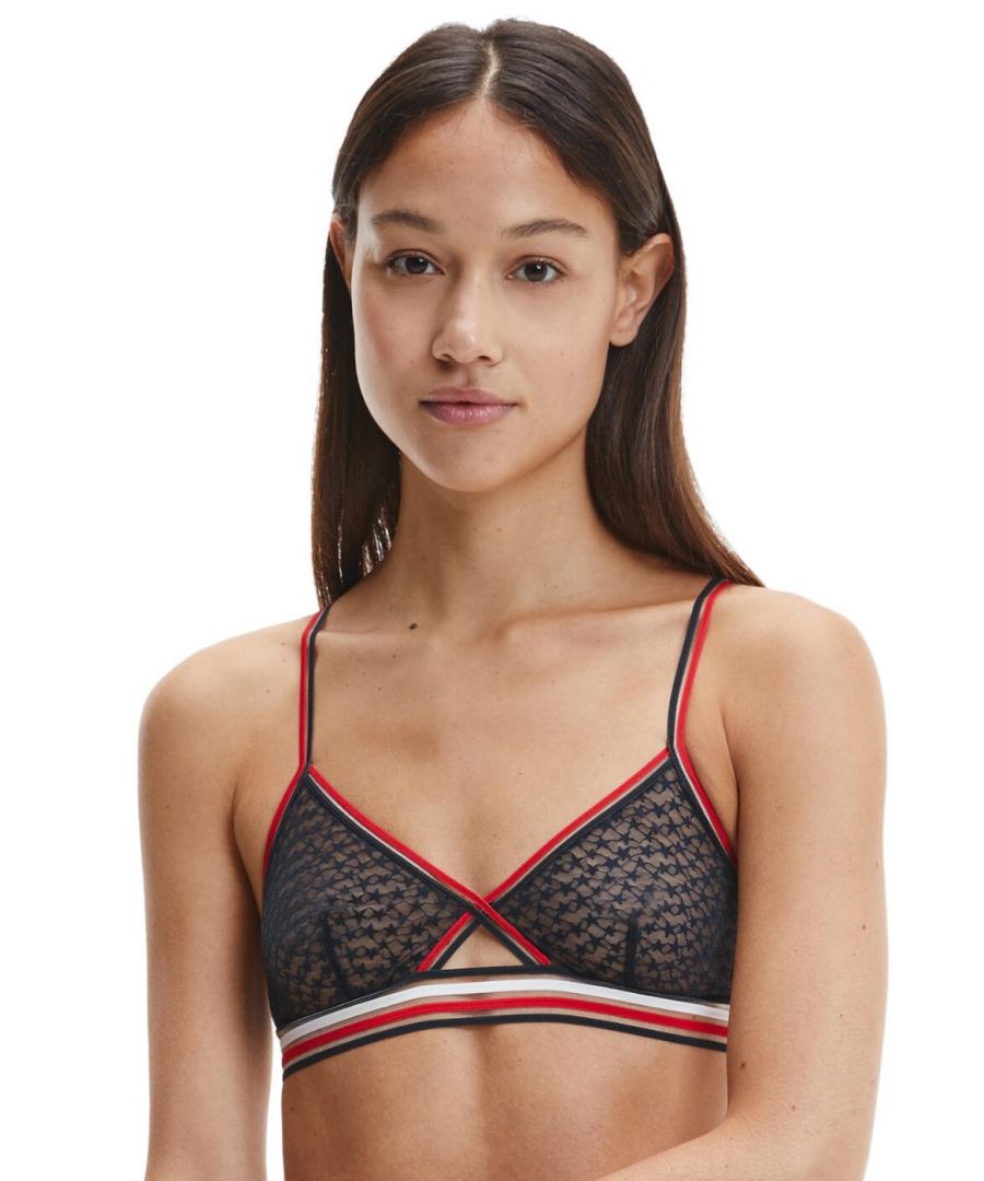 The Sheer Stripe lingerie line blends Tommy Hilfiger's timeless athleisure designs with premium semi-sheer tulle. This triangle bralette flaunts a youthful flirty style in a classic triangle shape.The key hole bridge detail and semi-sheer fabric that shows a touch of skin through for subtle star pattern creates a luxurious seductive look. Non-wired and non-padded for the utmost comfortable all-day fit. For a sexy sporty look, wear with coordinating lingerie from the Sheer Stripe range by Tommy Hilfiger.\n\nSexy athleisure style\nPatterned semi-sheer fabric\nNon-wired\nNon-padded\nHook and eye fastening\nSoft under-bust band\nCountry of origin: Thailand\nComposition: 71% Polyamide | 29% Elastane\nListed in UK sizes