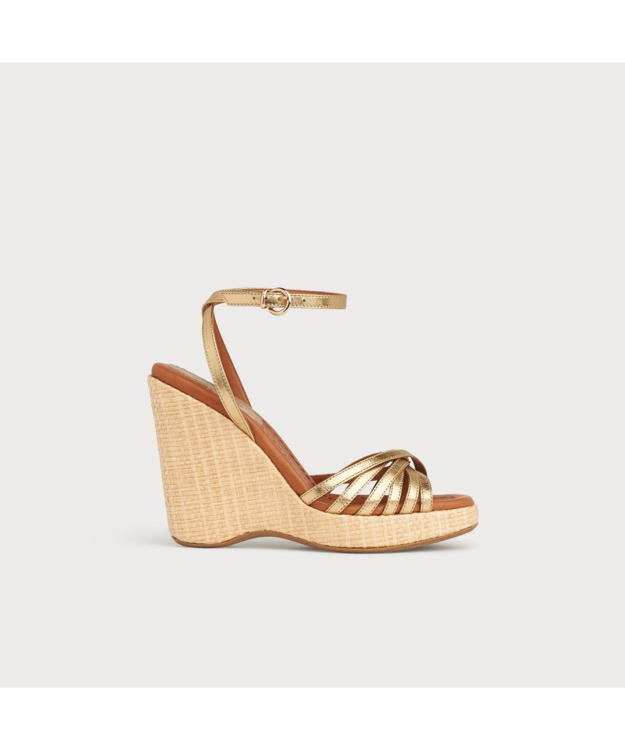With a hint of Seventies' playfulness, our Solange wedges balance height and comfort. Crafted in Italy from soft gold leather, they have a crossover multi-strap design, a delicate ankle strap and a beige raffia 110mm wedge sole. Perfect with summer's cool cotton and linen skirts and dresses, they're also great with wide leg trousers.