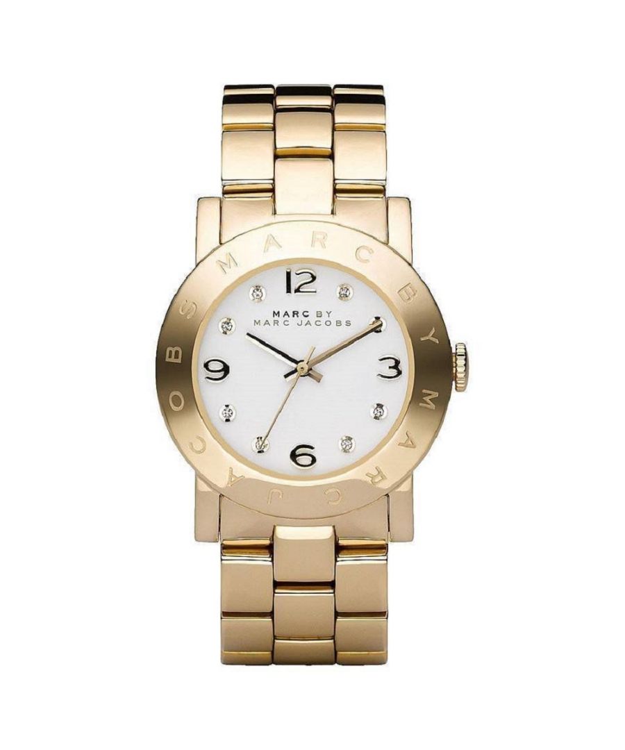 PRODUCT INFO - Case Diameter: 36mm   Case Material: PVD Gold Plated Stainless Steel\t   Water Resistant: 50 Metres   Movement: Quartz (Battery) Dial Colour: White   Strap Material: Gold Stainless Steel   Clasp Type: Push-Button Deployment   Gender: Female\n\nDESCRIPTION - This elegant piece blurs the lines between jewellery and timepiece, making it perfect for the fashion- forward female. It is made from a Gold stainless steel bracelet and has a sleek bracelet design in PVD Gold Plated metal and fastens with a push-button deployment. FREE Home Delivery - Including Next Day Service*. Available for gift wrap. We offer free bracelet adjustment service on this product. Please contact customer services for Returns policy