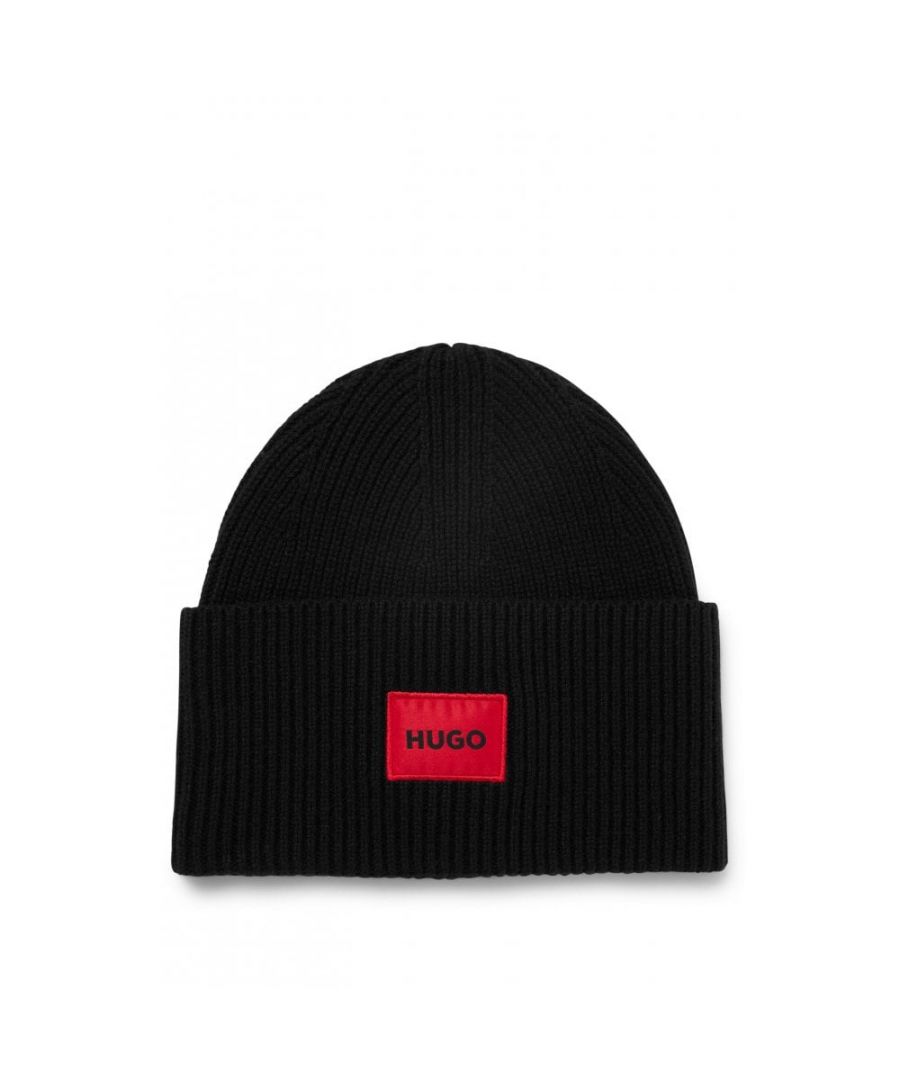 A modern beanie from HUGO is the perfect hat to finish off your cold-weather looks. Crafted in soft yarns rich in virgin wool for temperature-regulating comfort. Featuring a rib-knit structure with a turned-up cuff. Finished with the iconic red HUGO logo patch on the front.Rich Wool Blend, Rib-Knit Structure, Turned Up Cuffs, 80% Virgin Wool & 20% Polyamide, HUGO  Branding.