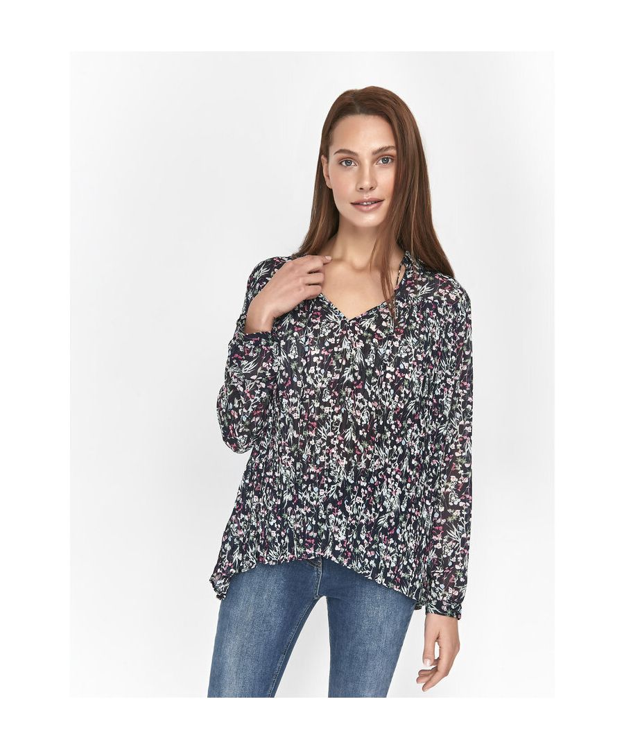 This pleated top from Sonder Studio is crafted from a subtle sheer fabric and boasts a stunning floral pattern. Featuing long sleeves and a v-neckline with tie detailing.